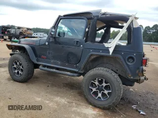 2005 Jeep Wrangler Rubicon with VIN 1J4FA69S75P340544, listed as a Copart auction lot 73085774 with 104,046 mi miles and Salvage Title. Bid and sale history available at carsss.com. Image 2.