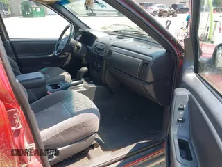 2001 Jeep Grand Cherokee Laredo z VIN 1J4GW48S11C720055, wystawiony jako IAAI lot #42453532 z przebiegiem 158 486 mil mil oraz . Historia ofert i sprzedaży dostępna na DreamBid. Obrazek 5.