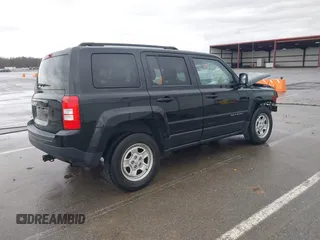 2014 Jeep Patriot Sport with VIN 1C4NJRBBXED879285, listed as a IAAI auction lot 41944152 with 103,676 mi miles. Bid and sale history available at carsss.com. Image 4.