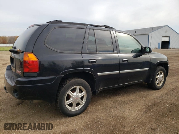 2007 GMC Envoy SLT with VIN 1GKDT13S972197393, listed as a Copart auction lot 77958764 with 151,586 mi miles and Salvage Title. Bid and sale history available at DreamBid. Image 3.