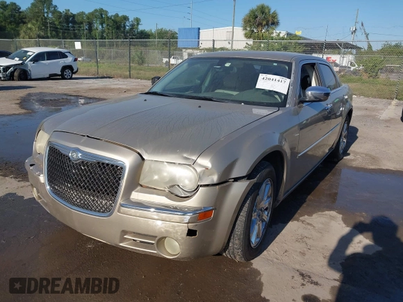 2009 Chrysler 300 Limited with VIN 2C3KA33V99H592963, listed as a IAAI auction lot 42041417 with 160,829 mi miles. Bid and sale history available at carsss.com. Image 2.