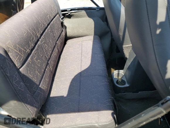 2002 Jeep Wrangler Sport with VIN 1J4FA49S02P721457, listed as a Copart auction lot 61726855 with 76,191 mi miles and Salvage title. Bid and sale history available at DreamBid. Image 11.