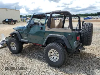 1999 Jeep Wrangler Sport with VIN 1J4FY19S0XP402688, listed as a Copart auction lot 58968125 with 211,910 mi miles and Salvage title. Bid and sale history available at DreamBid. Image 2.