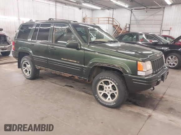 1997 Jeep Grand Cherokee Limited with VIN 1J4GZ78Y0VC684023, listed as a IAAI auction lot 42090436 with 310,831 mi miles. Bid and sale history available at carsss.com. Image 1.