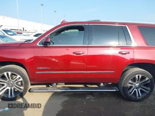 2017 GMC Yukon Denali with VIN 1GKS1CKJ4HR141145, listed as a IAAI auction lot 40799652 with 104,369 mi miles. Bid and sale history available at carsss.com. Image 13.