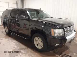 2011 Chevrolet Suburban LT with VIN 1GNSKJE32BR106273, listed as a IAAI auction lot 41079304 with 262,637 mi miles. Bid and sale history available at carsss.com. Image 1.