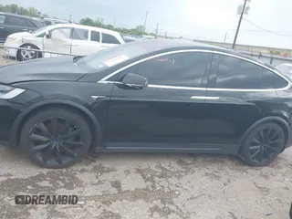 2021 Tesla Model X Long Range Plus with VIN 5YJXCAE27MF324270, listed as a IAAI auction lot 41886101 with 59,614 mi miles and . Bid and sale history available at carsss.com. Image 14.