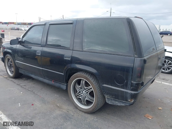 2000 Chevrolet Tahoe Limited with VIN 1GNEC13R7YR151624, listed as a IAAI auction lot 41785878 with 227,576 mi miles. Bid and sale history available at carsss.com. Image 3.