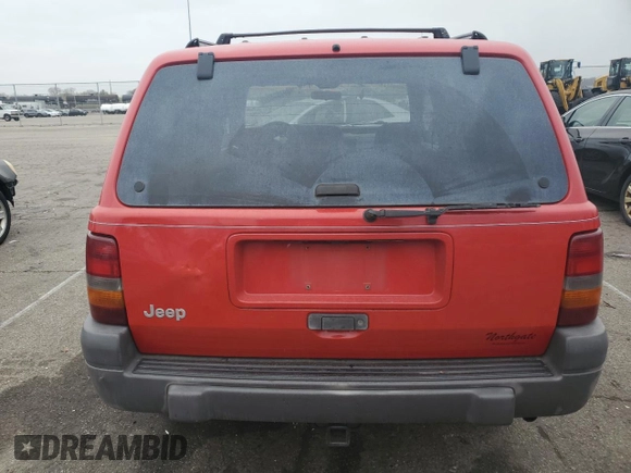 1996 Jeep Grand Cherokee Laredo with VIN 1J4GZ58S7TC292217, listed as a Copart auction lot 80757904 with 156,041 mi miles and Salvage Title. Bid and sale history available at carsss.com. Image 6.