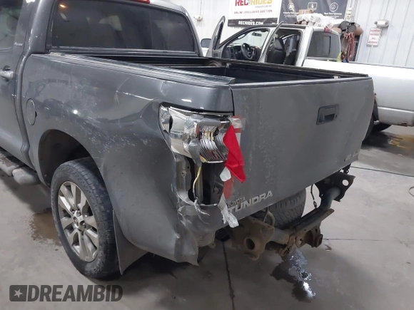 2012 Toyota Tundra 4WD Truck LTD with VIN 5TFHW5F14CX267765, listed as a IAAI auction lot 41345269 with 221,400 mi miles. Bid and sale history available at carsss.com. Image 6.
