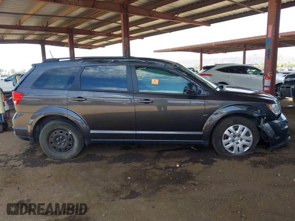 2019 Dodge Journey SE z VIN 3C4PDCBG9KT798938, wystawiony jako IAAI lot #42174970 z przebiegiem Nie podano mil oraz . Historia ofert i sprzedaży dostępna na DreamBid. Obrazek 12.