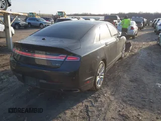 2015 Lincoln MKZ z VIN 3LN6L2J96FR619104, wystawiony jako IAAI lot #41794707 z przebiegiem 140 899 mil mil oraz . Historia ofert i sprzedaży dostępna na DreamBid. Obrazek 4.