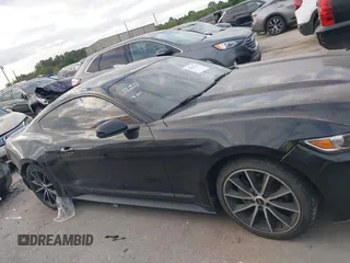 2016 Ford Mustang EcoBoost z VIN 1FA6P8THXG5267039, wystawiony jako IAAI lot #42014319 z przebiegiem 103 936 mil mil oraz . Historia ofert i sprzedaży dostępna na DreamBid. Obrazek 14.