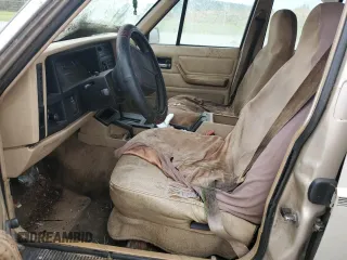 1995 Jeep Cherokee Sport with VIN 1J4FJ68S4SL618773, listed as a Copart auction lot 74126954 with 318,519 mi miles and Salvage title. Bid and sale history available at DreamBid. Image 7.