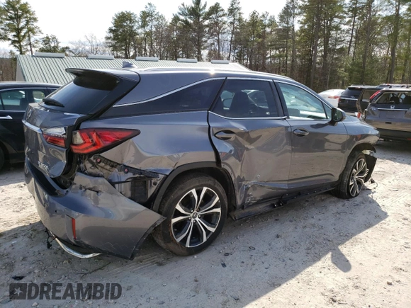 2018 Lexus RX 350L Premium with VIN JTJDZKCA8J2009751, listed as a Copart auction lot 51042215 with 104,454 mi miles and Salvage Title. Bid and sale history available at DreamBid. Image 3.
