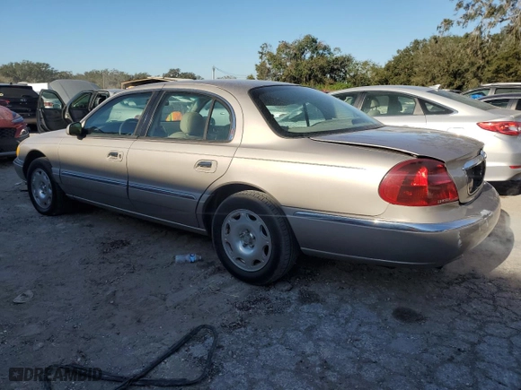 2000 Lincoln Continental with VIN 1LNHM97V4YY832947, listed as a Copart auction lot 83350184 with 164,389 mi miles and Salvage Title. Bid and sale history available at carsss.com. Image 2.