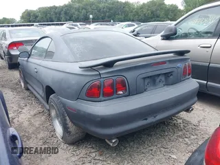 1997 Ford Mustang with VIN 1FALP4043VF158166, listed as a IAAI auction lot 39369761 with 124,992 mi miles. Bid and sale history available at carsss.com. Image 3.