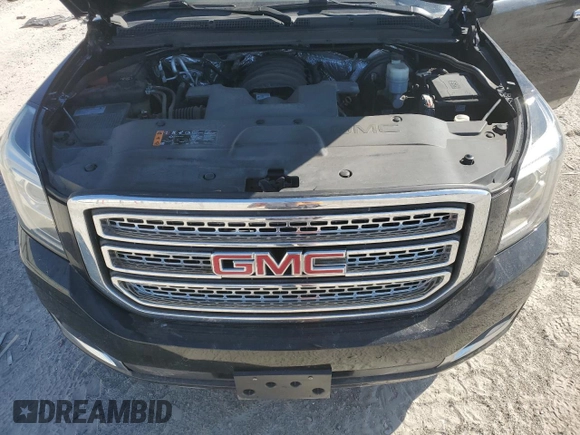 2018 GMC Yukon SLT with VIN 1GKS1BKC9JR108210, listed as a Copart auction lot 50465765 with 106,542 mi miles and Salvage Title. Bid and sale history available at carsss.com. Image 14.