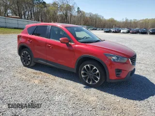 2016 Mazda CX-5 Grand Touring z VIN JM3KE2DYXG0840777, wystawiony jako Copart lot #49700585 z przebiegiem 116 469 mil mil oraz Szkoda całkowita • Salvage title. Historia ofert i sprzedaży dostępna na DreamBid. Obrazek 4.