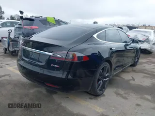 2018 Tesla Model S 75D with VIN 5YJSA1E42JF265691, listed as a IAAI auction lot 41886105 with 99,485 mi miles and . Bid and sale history available at DreamBid. Image 4.