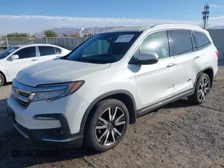 2022 Honda Pilot Touring 7-Passenger with VIN 5FNYF6H67NB017660, listed as a IAAI auction lot 41194603 with 87,301 mi miles. Bid and sale history available at carsss.com. Image 2.