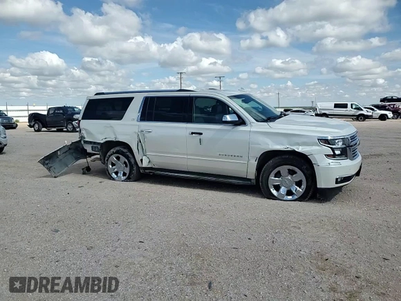 2015 Chevrolet Suburban LTZ with VIN 1GNSCKKC6FR705660, listed as a Copart auction lot 60328685 with 174,247 mi miles and Salvage title. Bid and sale history available at DreamBid. Image 14.