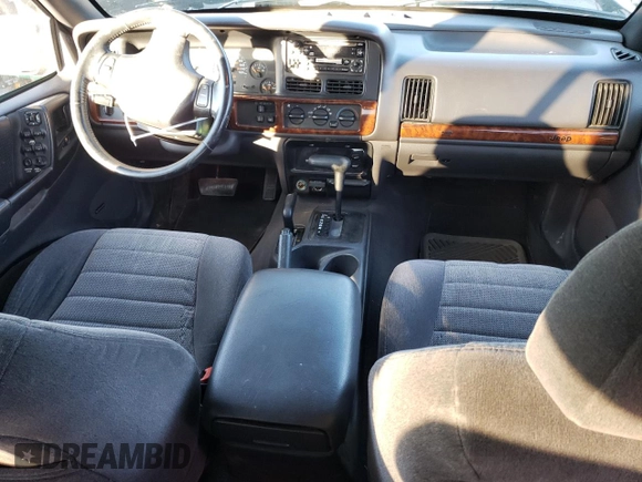 1997 Jeep Grand Cherokee Laredo with VIN 1J4GZ58Y6VC647434, listed as a Copart auction lot 73496824 with 124,946 mi miles and Salvage Title. Bid and sale history available at carsss.com. Image 8.