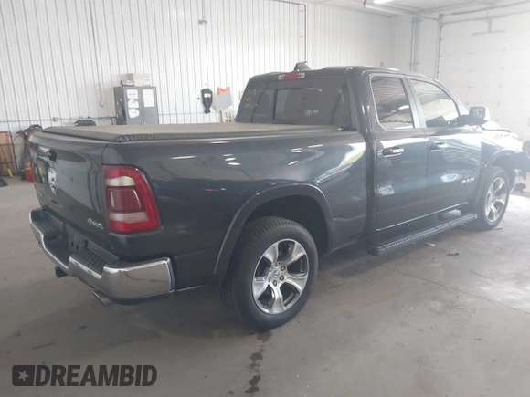 2020 Ram 1500 Laramie with VIN 1C6SRFDT7LN142009, listed as a IAAI auction lot 42330341 with 108,351 mi miles and . Bid and sale history available at DreamBid. Image 4.