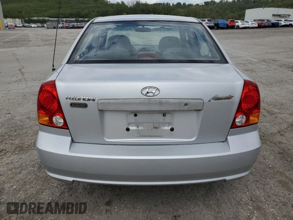 2004 Hyundai Accent GL with VIN KMHCG45C94U515186, listed as a Copart auction lot 52697284 with 49,236 mi miles and Salvage Title. Bid and sale history available at carsss.com. Image 6.