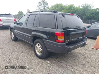 2003 Jeep Grand Cherokee Laredo with VIN 1J4GW48NX3C532874, listed as a IAAI auction lot 42613091 with 165,920 mi miles and . Bid and sale history available at DreamBid. Image 3.