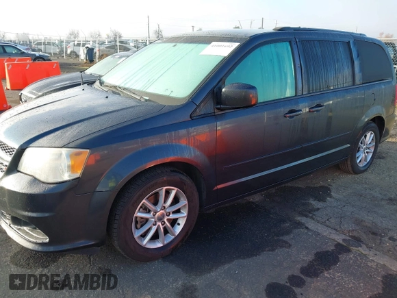 2014 Dodge Grand Caravan SXT with VIN 2C4RDGCG2ER267358, listed as a IAAI auction lot 41001692 with 186,763 mi miles and . Bid and sale history available at DreamBid. Image 2.