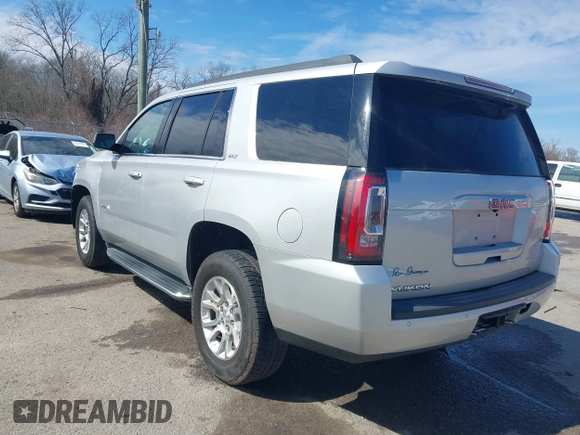 2019 GMC Yukon SLT with VIN 1GKS1BKC5KR277478, listed as a IAAI auction lot 41632624 with 86,770 mi miles. Bid and sale history available at carsss.com. Image 3.