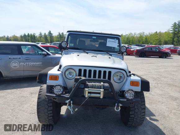 2003 Jeep Wrangler Sport z VIN 1J4FA49S73P302278, wystawiony jako IAAI lot #42219582 z przebiegiem 129 089 mil mil oraz . Historia ofert i sprzedaży dostępna na DreamBid. Obrazek 12.