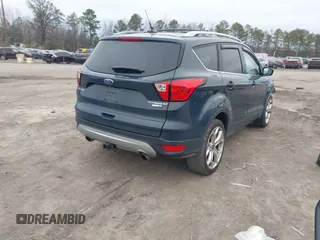 2019 Ford Escape Titanium with VIN 1FMCU9J93KUB84831, listed as a IAAI auction lot 41514146 with 105,072 mi miles. Bid and sale history available at carsss.com. Image 4.