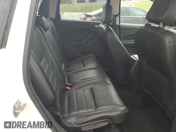 2018 Ford Escape Titanium z VIN 1FMCU9J94JUB49827, wystawiony jako Copart lot #55697385 z przebiegiem 98 682 mil mil oraz Szkoda całkowita • Salvage title. Historia ofert i sprzedaży dostępna na DreamBid. Obrazek 11.
