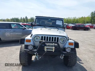 2003 Jeep Wrangler Sport z VIN 1J4FA49S73P302278, wystawiony jako IAAI lot #42219582 z przebiegiem 129 089 mil mil oraz . Historia ofert i sprzedaży dostępna na DreamBid. Obrazek 12.