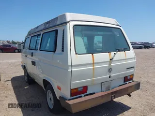 1991 Volkswagen Vanagon GL with VIN WV2ZB0258MG006802, listed as a IAAI auction lot 41969597 with 241,953 mi miles and . Bid and sale history available at DreamBid. Image 3.