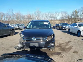2014 Volkswagen Tiguan S z VIN WVGBV3AX4EW581302, wystawiony jako IAAI lot #41033175 z przebiegiem 69 791 mil mil oraz . Historia ofert i sprzedaży dostępna na DreamBid. Obrazek 12.