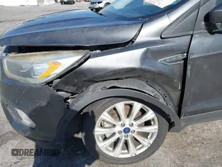 2018 Ford Escape Titanium with VIN 1FMCU0J98JUA03474, listed as a IAAI auction lot 37677880 with 106,423 mi miles and . Bid and sale history available at DreamBid. Image 6.
