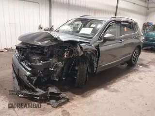 2021 Volkswagen Tiguan SE with VIN 3VV3B7AX3MM118463, listed as a IAAI auction lot 42138702 with 48,058 mi miles and . Bid and sale history available at DreamBid. Image 2.