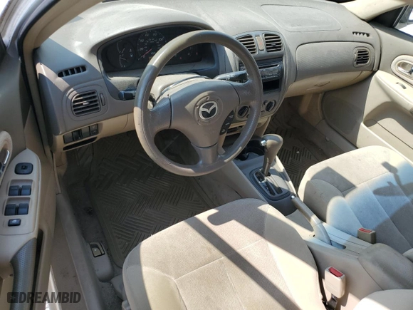 2002 Mazda Protege DX with VIN JM1BJ225X21597889, listed as a Copart auction lot 72237874 with 254,402 mi miles and Salvage Title. Bid and sale history available at carsss.com. Image 8.