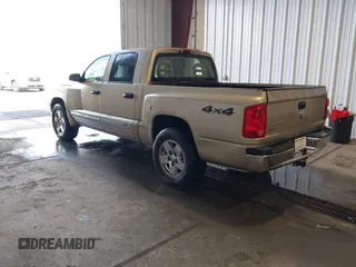 2005 Dodge Dakota Laramie with VIN 1D7HW58N15S159061, listed as a IAAI auction lot 41898306 with 114,288 mi miles and . Bid and sale history available at DreamBid. Image 3.