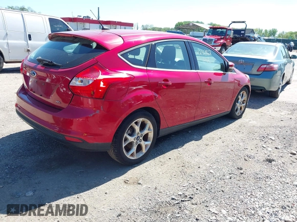 2012 Ford Focus SEL with VIN 1FAHP3M22CL335913, listed as a IAAI auction lot 42143922 with 129,421 mi miles. Bid and sale history available at carsss.com. Image 4.