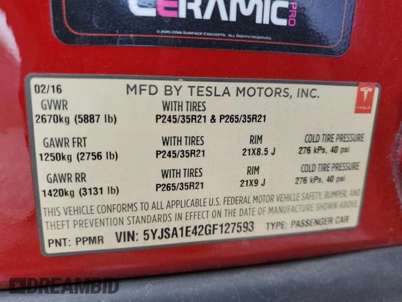 2016 Tesla Model S 90D with VIN 5YJSA1E42GF127593, listed as a Copart auction lot 52450495 with 144,151 mi miles and Salvage title. Bid and sale history available at DreamBid. Image 14.