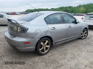 2005 Mazda 3 s with VIN JM1BK123551254112, listed as a IAAI auction lot 42153452 with 258,826 mi miles and . Bid and sale history available at DreamBid. Image 4.