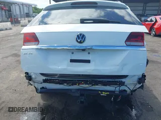 2021 Volkswagen Atlas SE z VIN 1V2WR2CA2MC529355, wystawiony jako IAAI lot #41972048 z przebiegiem 63 970 mil mil oraz . Historia ofert i sprzedaży dostępna na DreamBid. Obrazek 6.