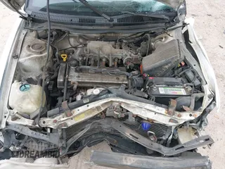 1997 Geo Prizm LSi with VIN 1Y1SK5266VZ417087, listed as a IAAI auction lot 42009913 with 198,041 mi miles. Bid and sale history available at carsss.com. Image 6.