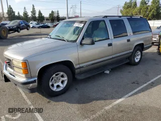 1999 GMC Suburban with VIN 3GKEC16R0XG526194, listed as a Copart auction lot 83740634 with 199,583 mi miles and Clean Title. Bid and sale history available at DreamBid. Image 1.