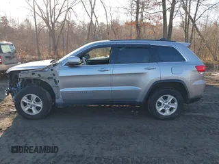 2015 Jeep Grand Cherokee Laredo with VIN 1C4RJFAG9FC775004, listed as a IAAI auction lot 41754534 with 116,893 mi miles. Bid and sale history available at carsss.com. Image 14.