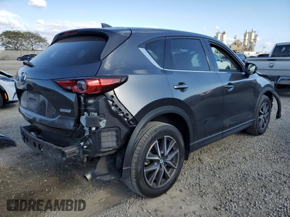 2018 Mazda CX-5 Grand Touring with VIN JM3KFADM8J1330353, listed as a Copart auction lot 54752325 with 96,577 mi miles and Salvage Title. Bid and sale history available at DreamBid. Image 3.
